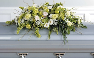 Arranging coffin and wreath