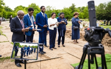 Filming funeral service